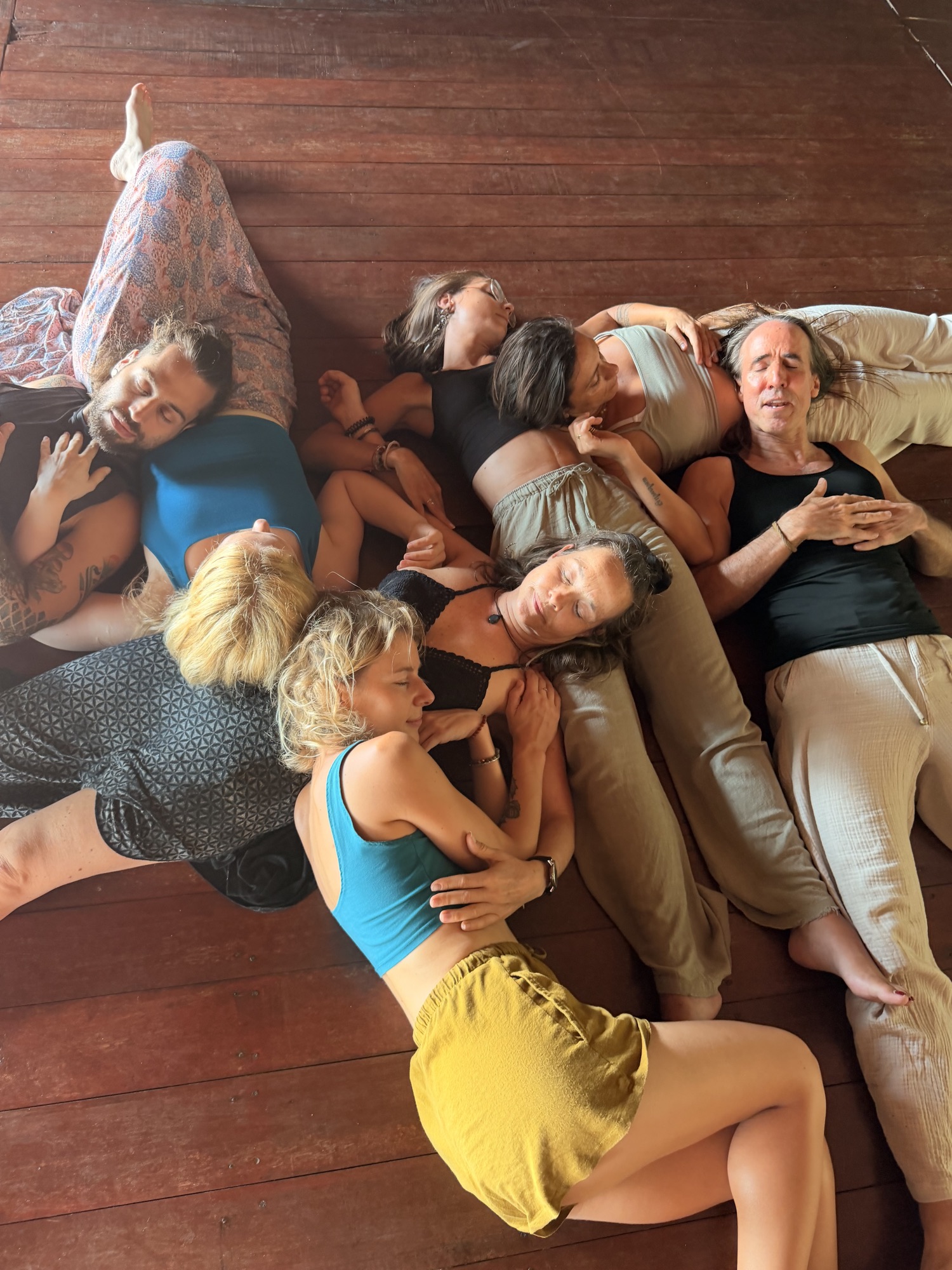 Group lying on the floor together in stillness