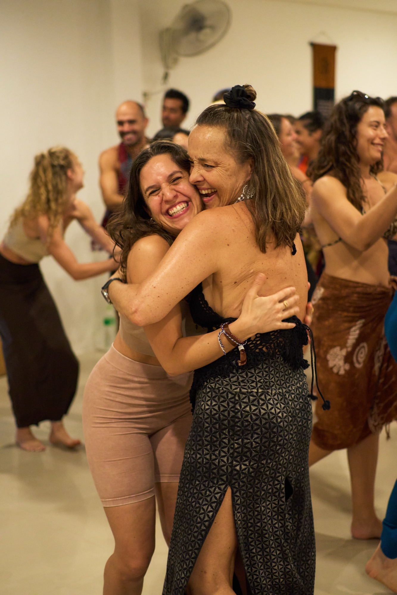 Lisa hugging a participant with warmth and belonging