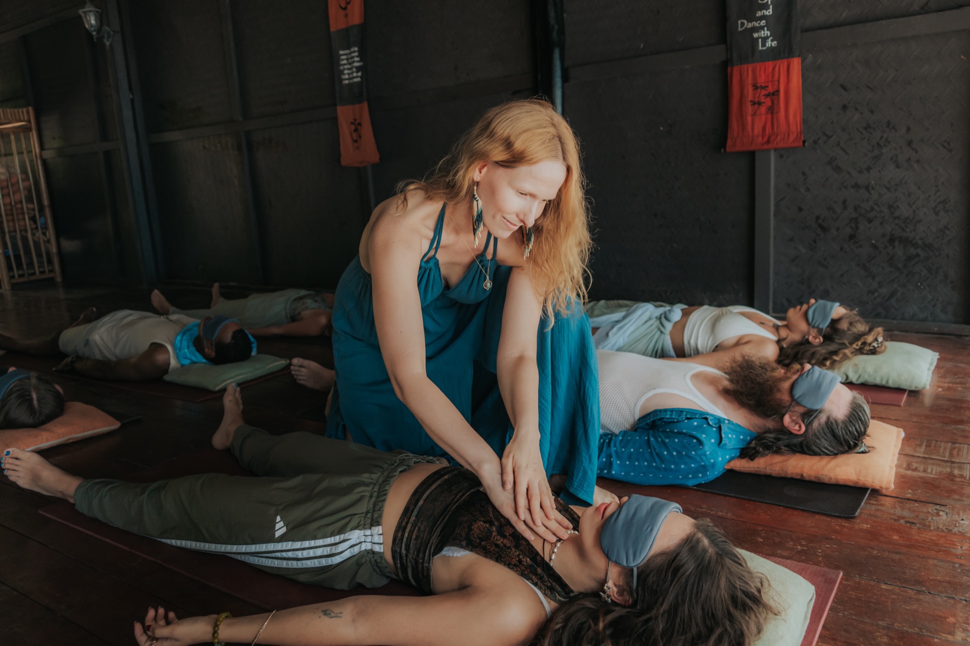 Lisa facilitating breathwork with a participant